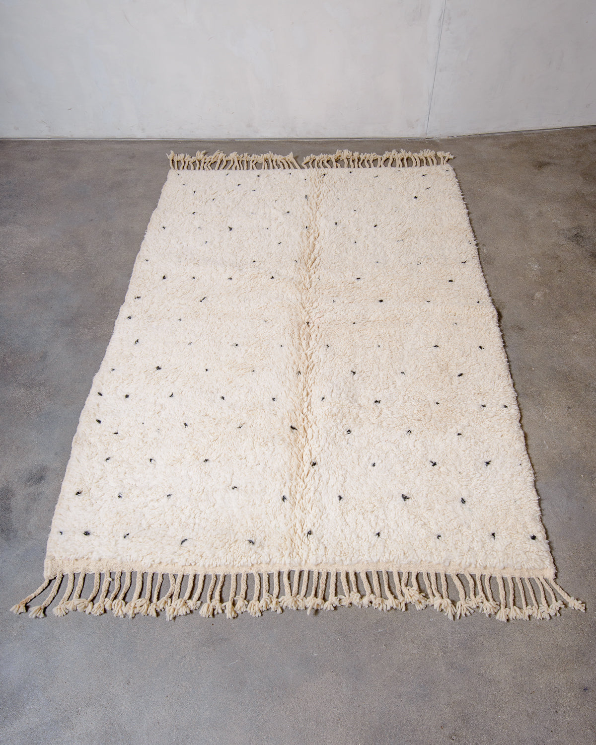Modern, designer, handcrafted Berber rug from Morocco. Beniourain carpet with minimalist design, natural wool pile and a fluffy texture.